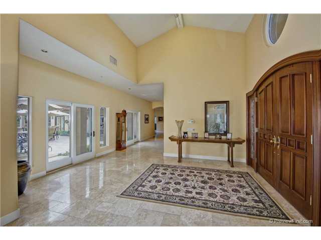 17704 Vineyard Lane Poway, CA 92064 - Photo 3 of 25 Grand Formal Entry. Open to Back Courtyard. Stone Floors