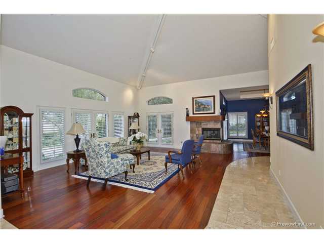 17704 Vineyard Lane Poway, CA 92064 - Photo 4 of 25 Formal Living Room with French Doors and Large Wood Burning Fireplace. New Hardwood Floors