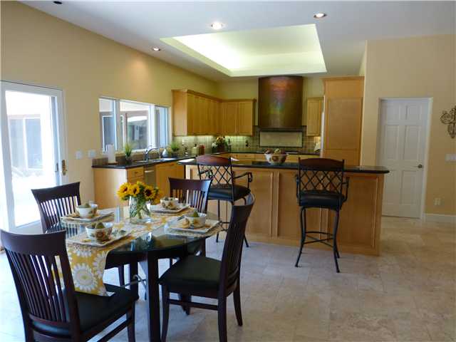 17704 Vineyard Lane Poway, CA 92064 - Photo 8 of 25 Large Breakfast Bar and informal Dining Area. Kitchen boasts Copper cooktop Hood