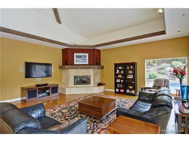 17704 Vineyard Lane Poway, CA 92064 - Photo 9 of 25 Large Family Room. Corner Fireplace. Bar for entertaining