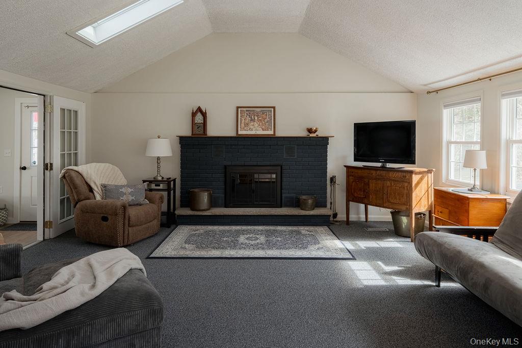307 Sepasco Lake Road Rhinebeck, NY 12572 - Photo 3 of 24 a living room with furniture and a flat screen tv