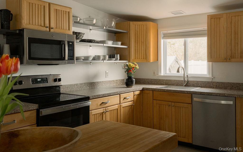 307 Sepasco Lake Road Rhinebeck, NY 12572 - Photo 6 of 24 a kitchen with stainless steel appliances granite countertop a sink and a stove