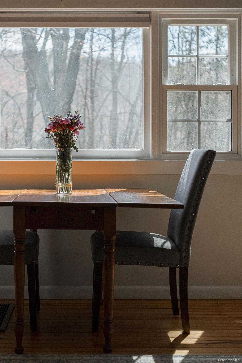 307 Sepasco Lake Road Rhinebeck, NY 12572 - Photo 10 of 24 a view of a dining room with furniture window and wooden floor