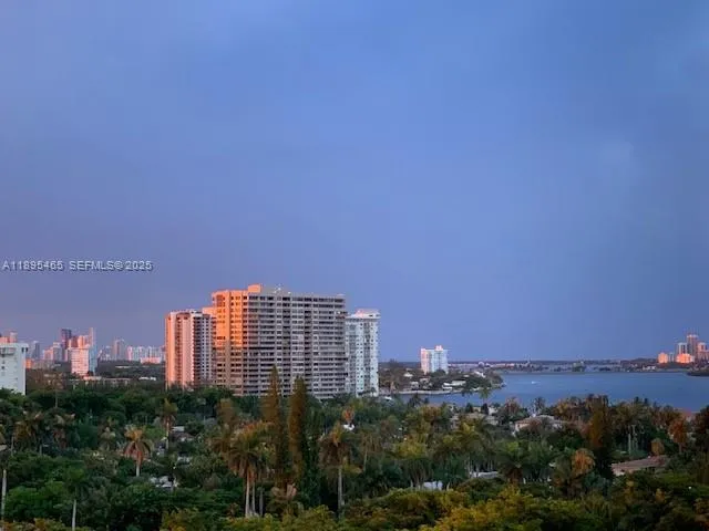 a bedroom with bed and night stand