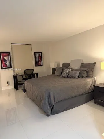 a bathroom with a toilet sink and shower