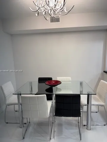 a living room with furniture large window and a flat screen tv