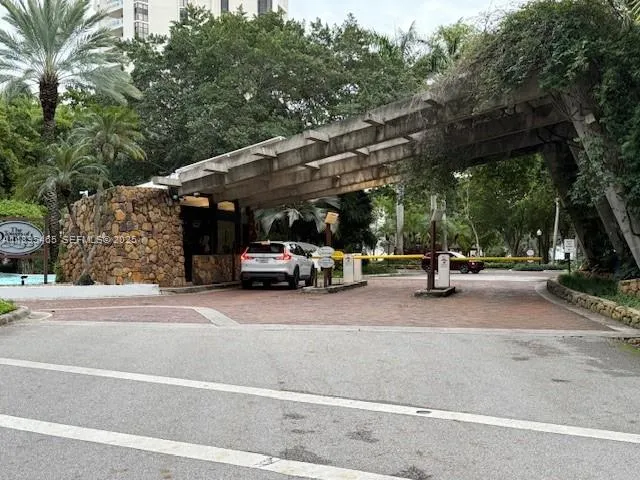 a view of a garden with plants and trees