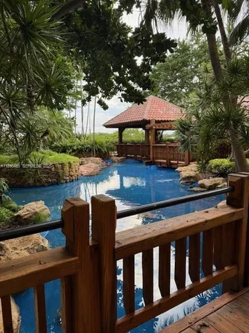 a view of a swimming pool with lounge chair