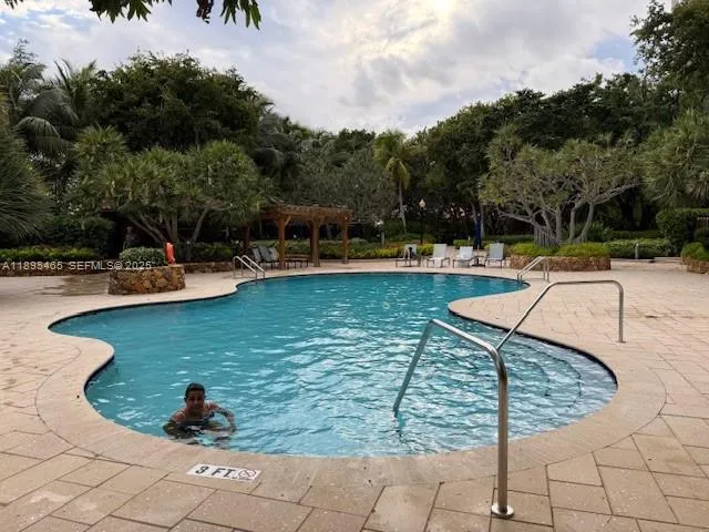 a view of a patio with table and chairs