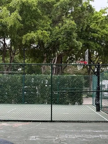 a view of a house with basketball court