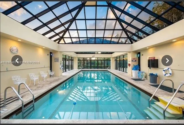 a view of a house with a swimming pool and a garden