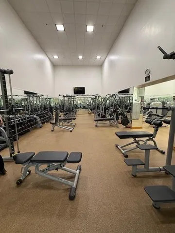 a roof deck with table and chairs