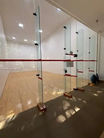 a view of a room with furniture and a table