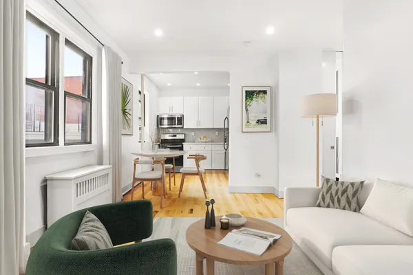 a living room with furniture and a table