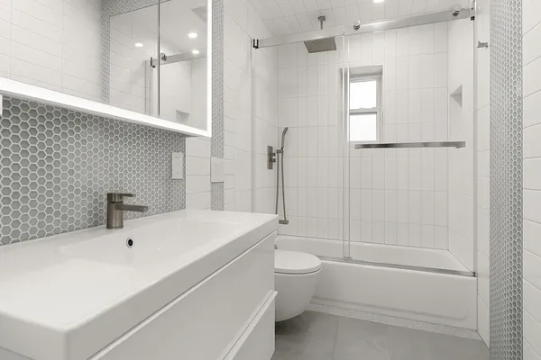 a bathroom with a white bath tub a toilet and a sink