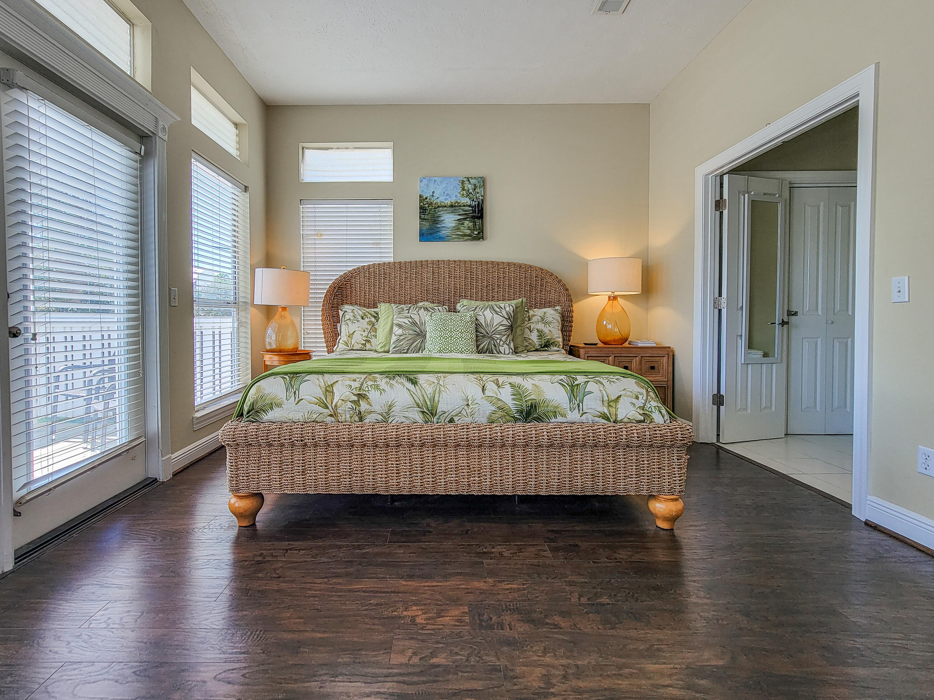 3567 East County Highway 30A Santa Rosa Beach, FL 32459 - Photo 14 of 31 a bedroom with a bed and wooden floor
