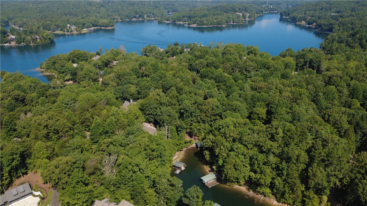 601 Wind Flower Drive Sunset, SC 29685 - Photo 6 of 11 A protected cove provides calm waters for swimming, paddleboarding, and kayaking, while your private covered dock offers quick access to the open waters of Lake Keowee.