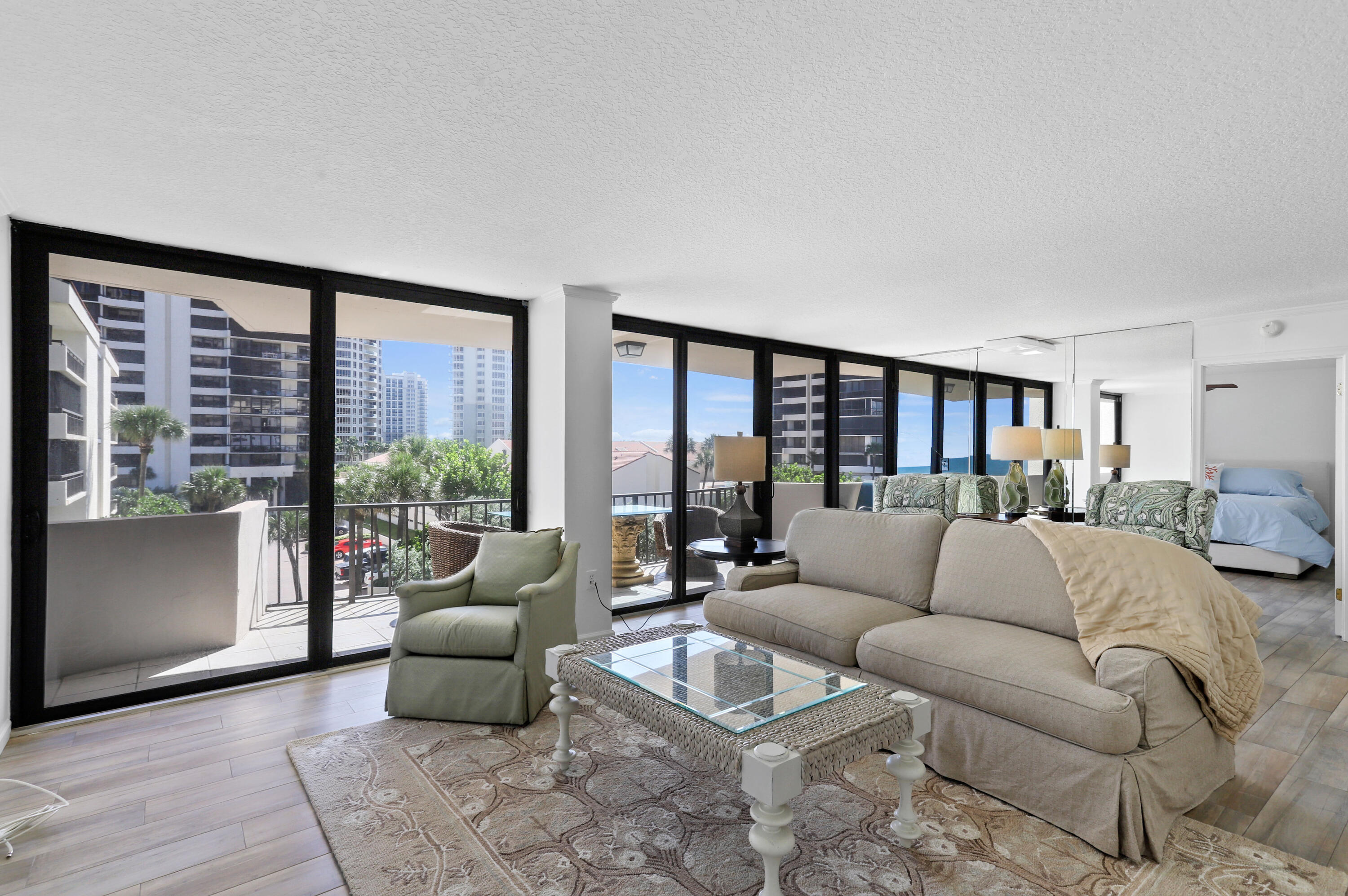 4200 North Ocean Drive, Unit 1 Riviera Beach, FL 33404 - Photo 11 of 59 a living room with furniture and a large window