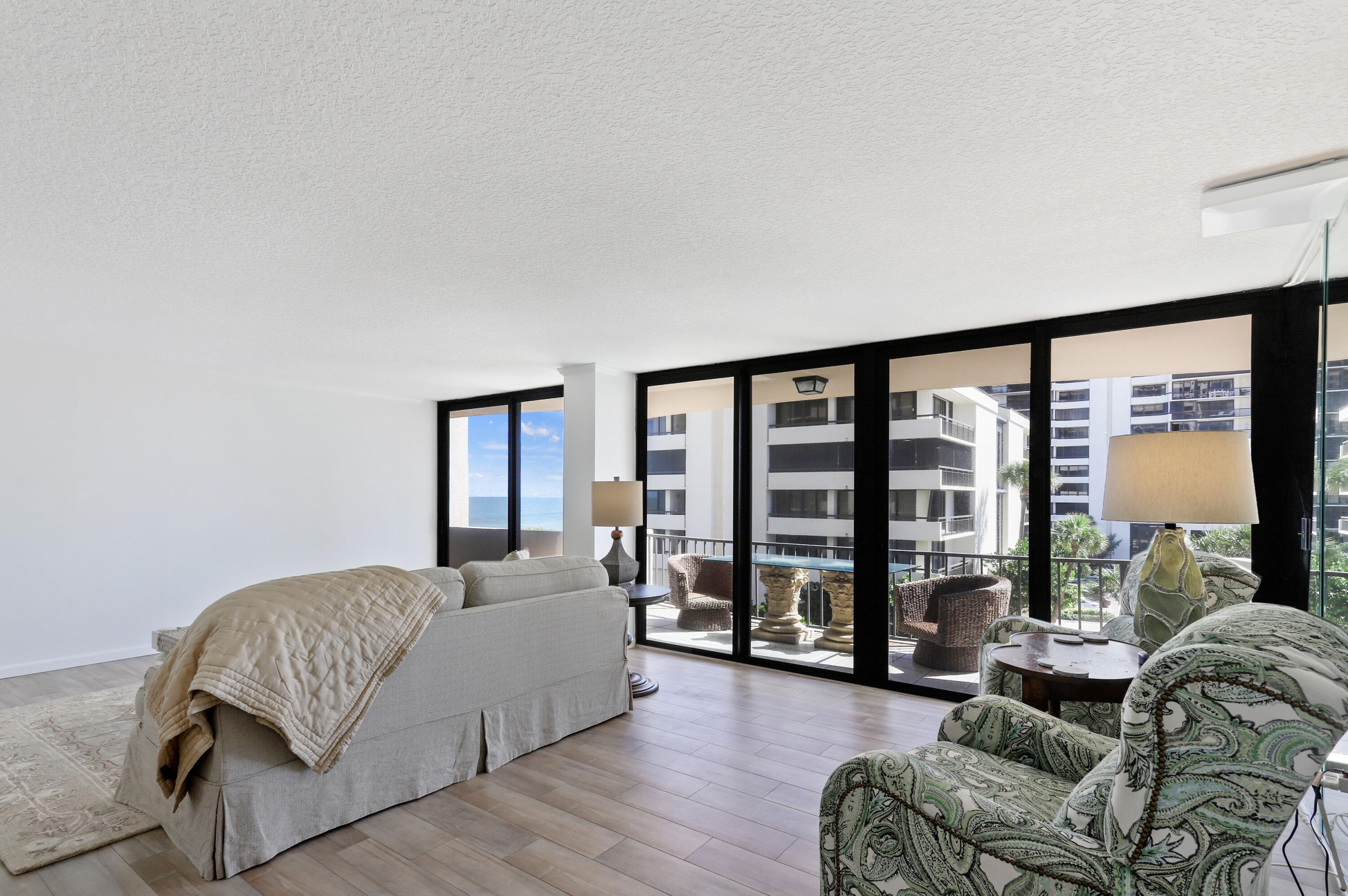 4200 North Ocean Drive, Unit 1 Riviera Beach, FL 33404 - Photo 12 of 59 a living room with furniture and a large window