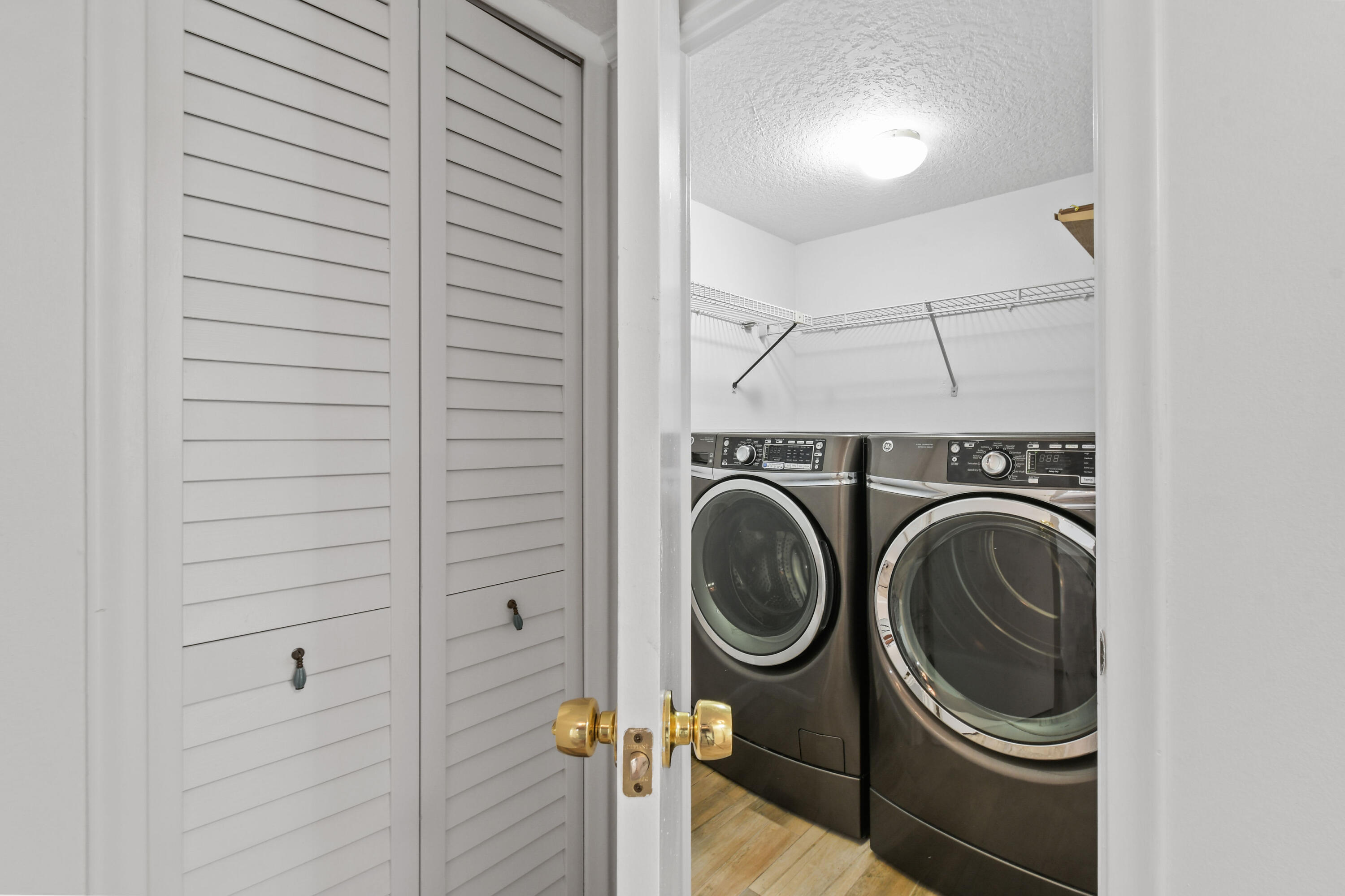 4200 North Ocean Drive, Unit 1 Riviera Beach, FL 33404 - Photo 14 of 59 a utility room with dryer and washer