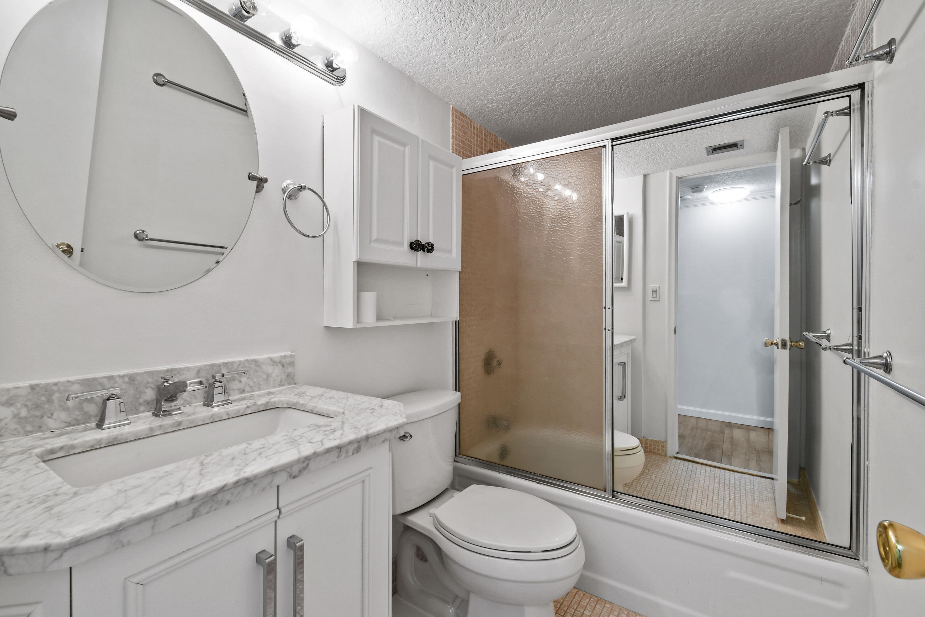 4200 North Ocean Drive, Unit 1 Riviera Beach, FL 33404 - Photo 15 of 59 a bathroom with a granite countertop sink toilet and shower