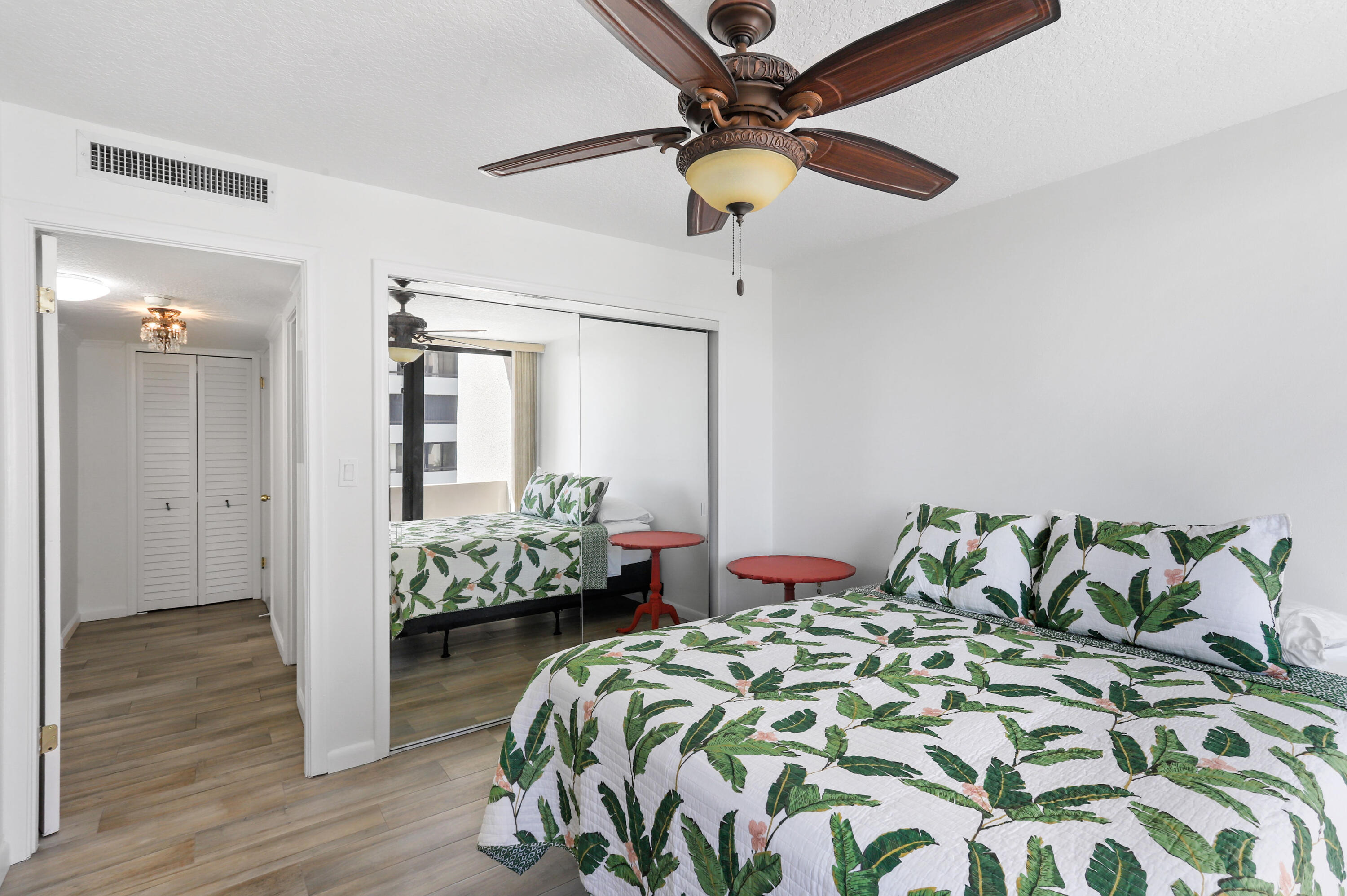 4200 North Ocean Drive, Unit 1 Riviera Beach, FL 33404 - Photo 17 of 59 a bedroom with bed and wooden floor