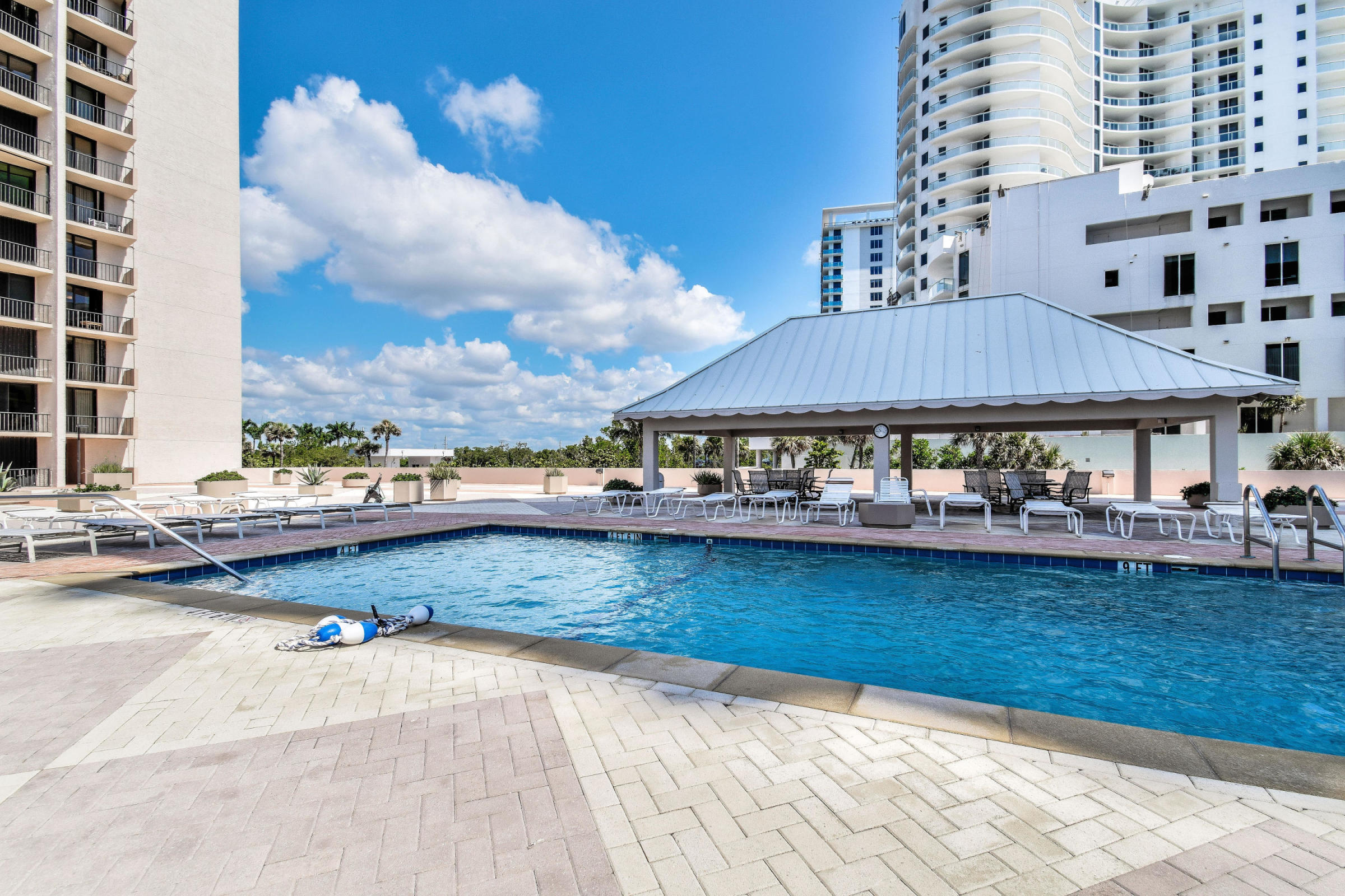 4200 North Ocean Drive, Unit 1 Riviera Beach, FL 33404 - Photo 19 of 59 a view of swimming pool with outdoor seating and plants
