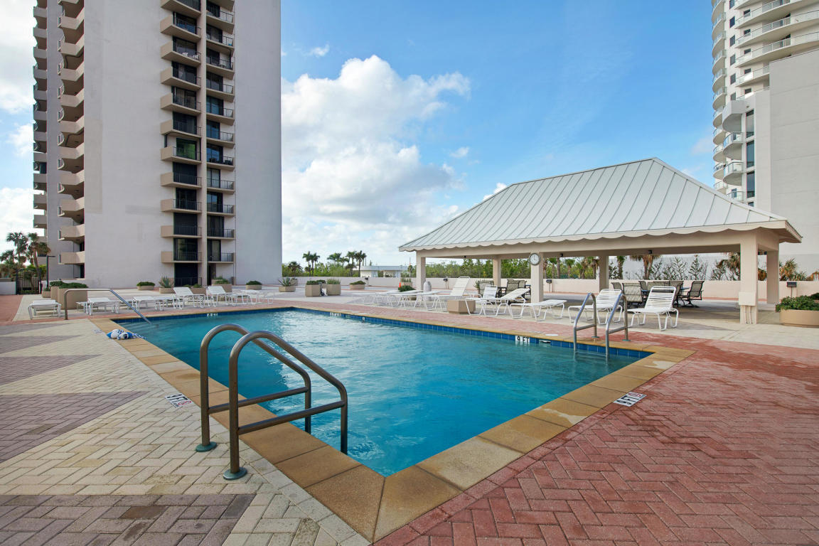 4200 North Ocean Drive, Unit 1 Riviera Beach, FL 33404 - Photo 20 of 59 a swimming pool with outdoor seating and yard
