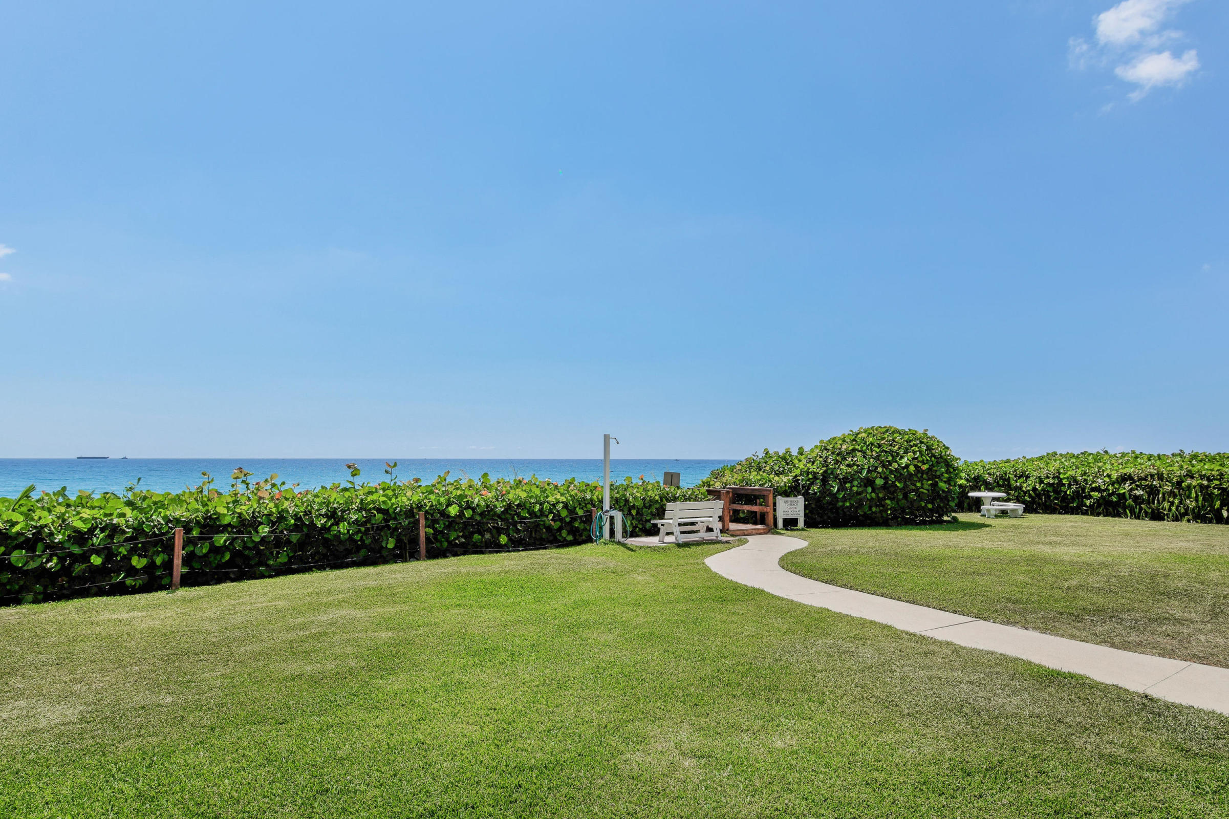 4200 North Ocean Drive, Unit 1 Riviera Beach, FL 33404 - Photo 23 of 59 a view of a grassy field with an trees