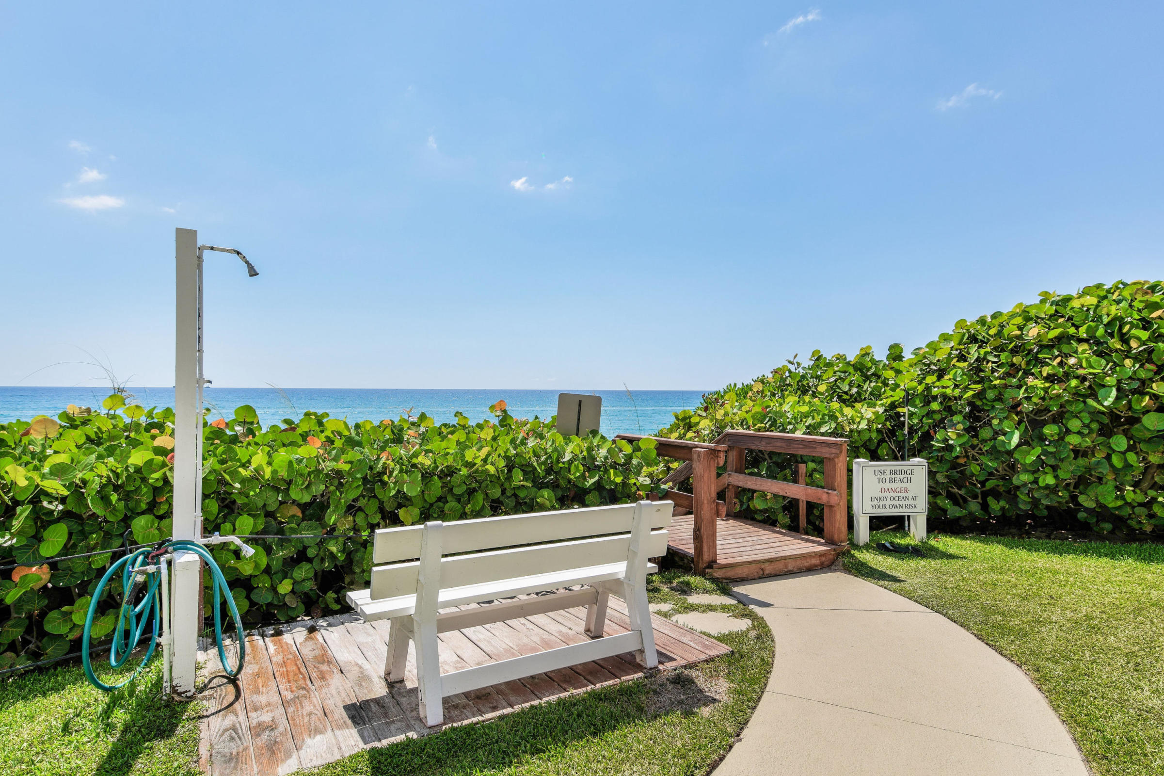 4200 North Ocean Drive, Unit 1 Riviera Beach, FL 33404 - Photo 24 of 59 a view of a backyard with couches plants and large tree