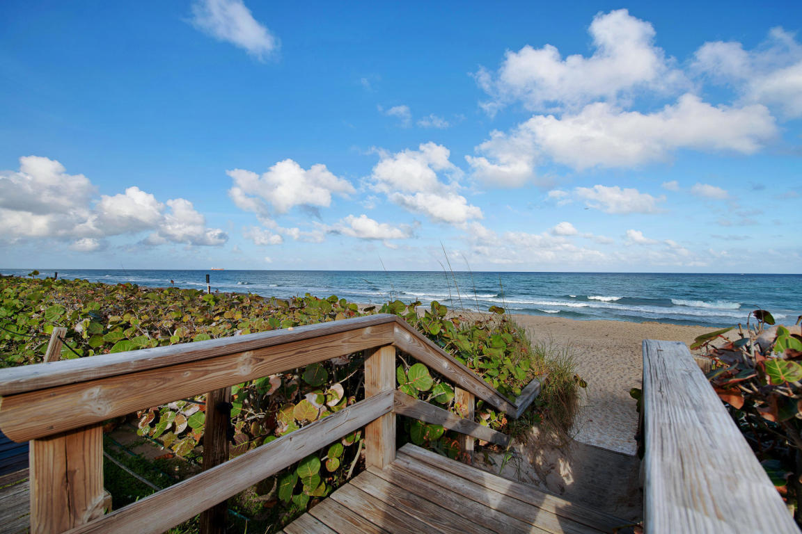 4200 North Ocean Drive, Unit 1 Riviera Beach, FL 33404 - Photo 27 of 59 a view of a balcony with wooden chairs