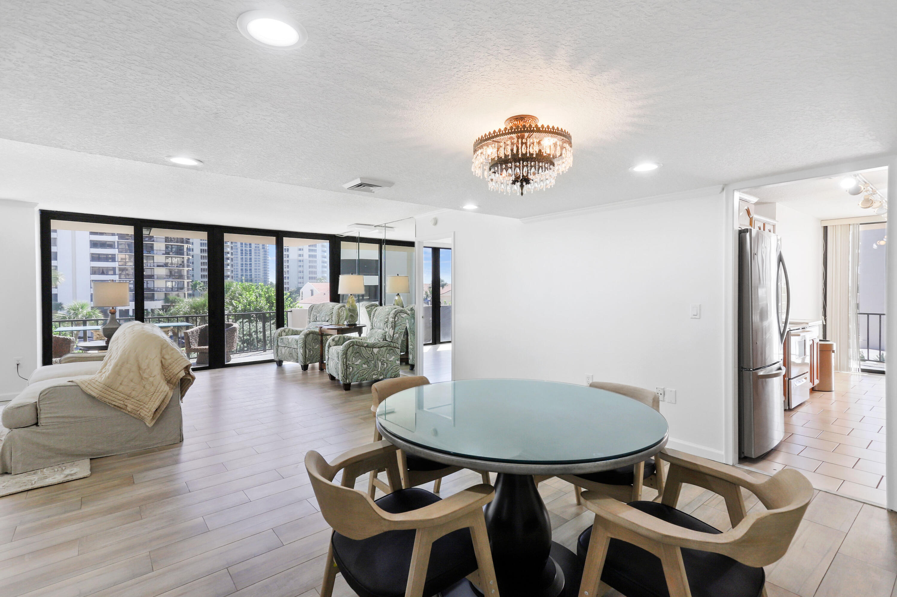 4200 North Ocean Drive, Unit 1 Riviera Beach, FL 33404 - Photo 4 of 59 a view of a livingroom with furniture and floor to ceiling window