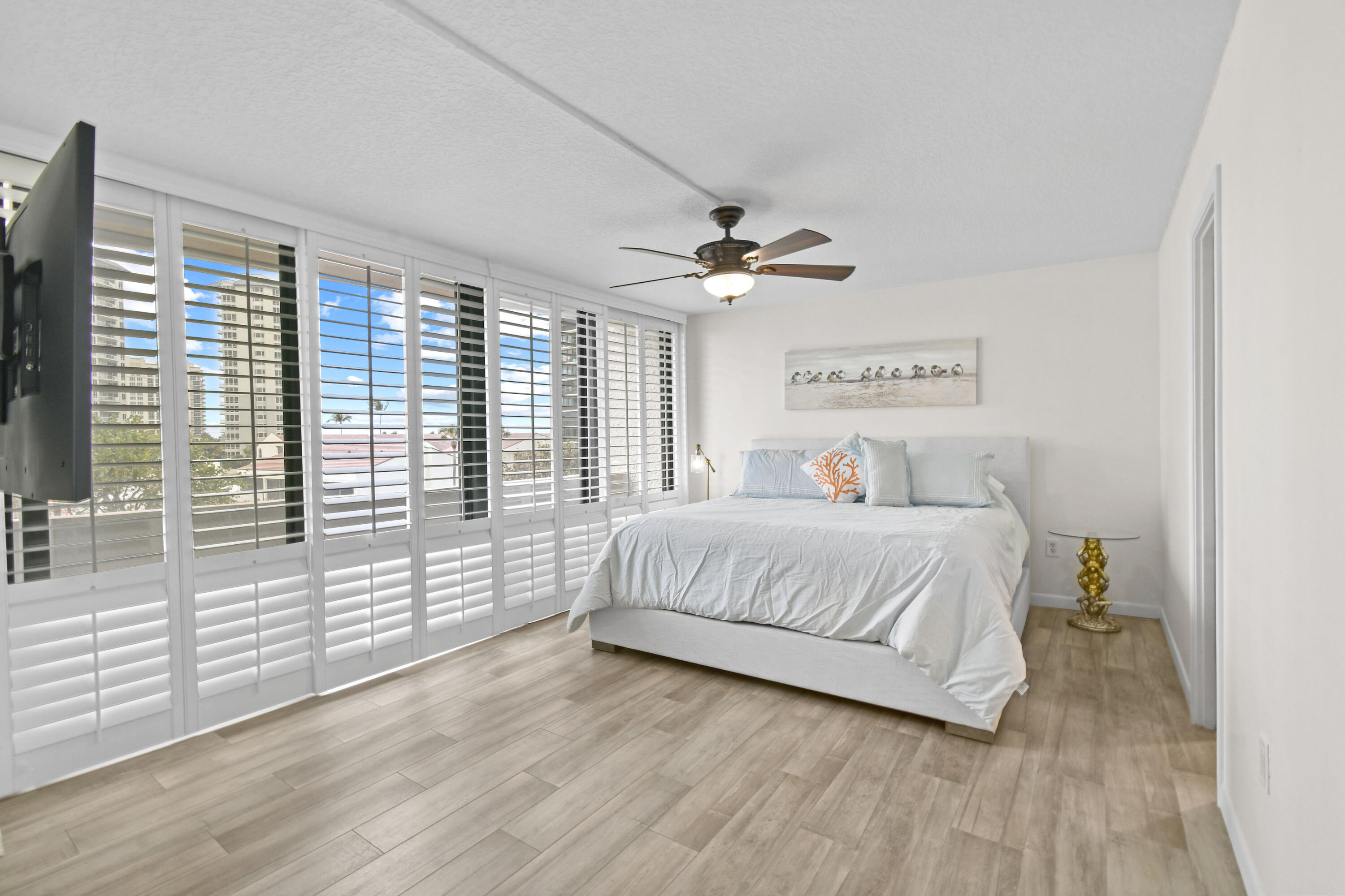 4200 North Ocean Drive, Unit 1 Riviera Beach, FL 33404 - Photo 49 of 59 a bedroom with a large bed and a large window