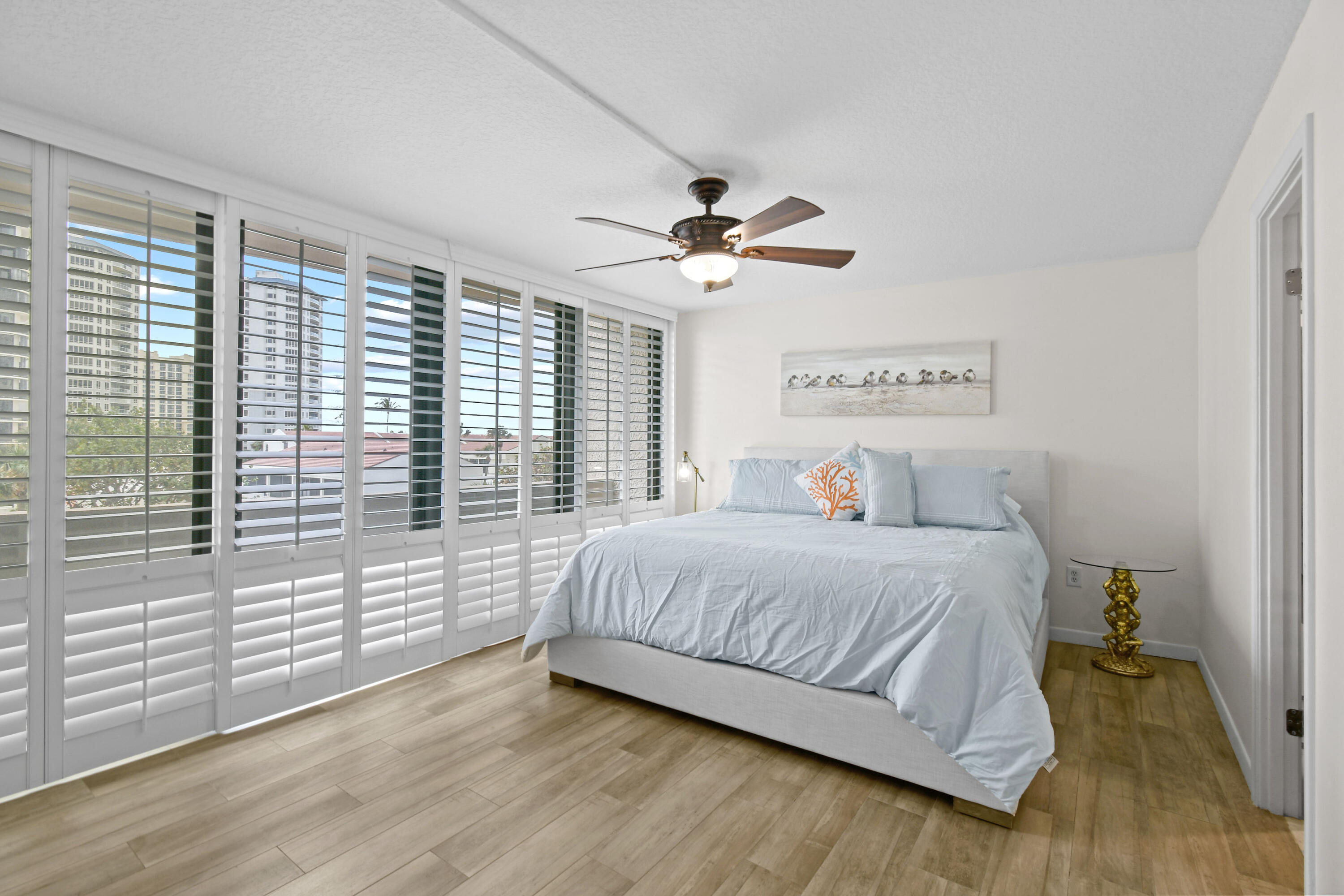 4200 North Ocean Drive, Unit 1 Riviera Beach, FL 33404 - Photo 50 of 59 a bedroom with a large bed and a large window