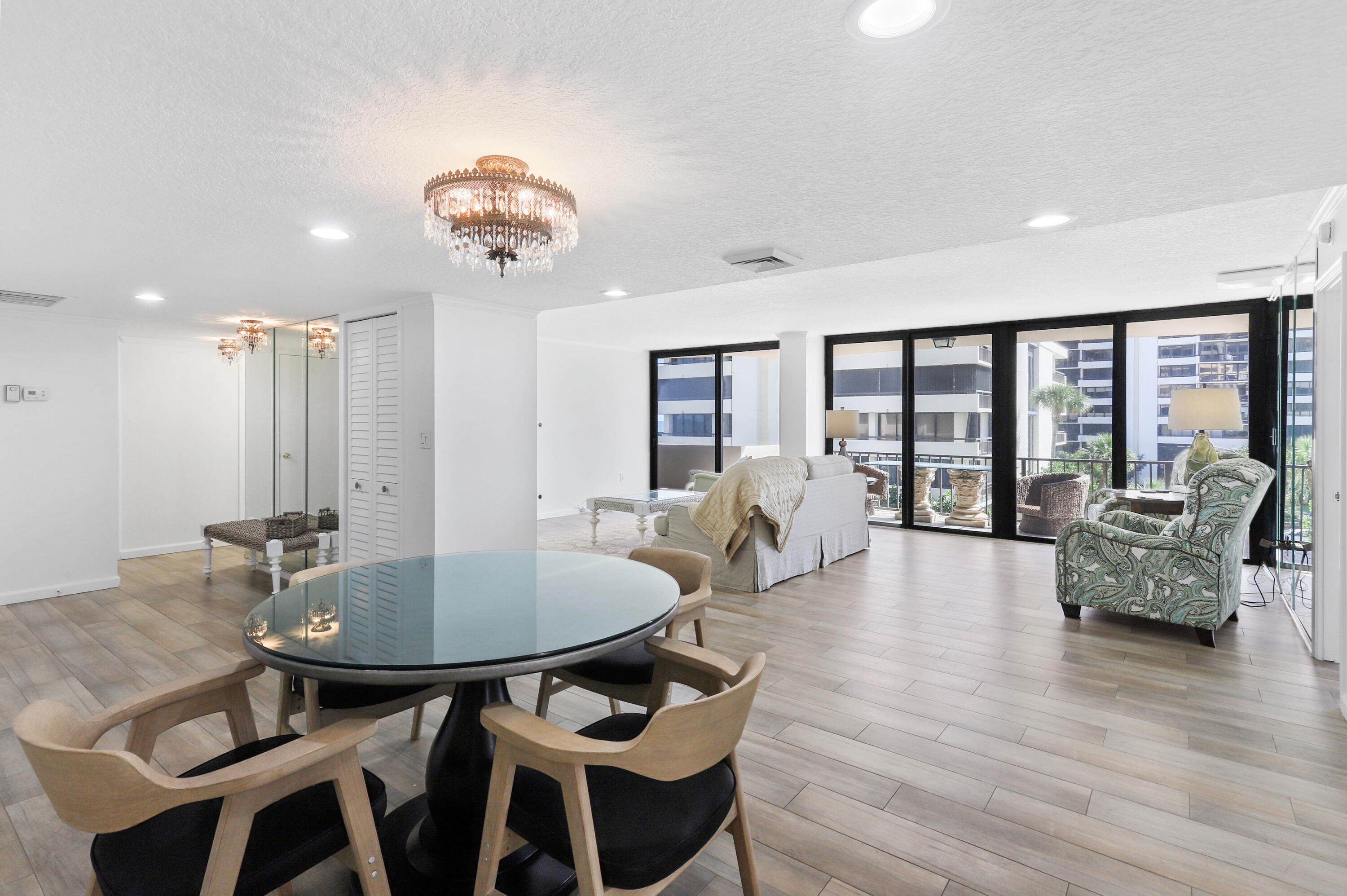 4200 North Ocean Drive, Unit 1 Riviera Beach, FL 33404 - Photo 5 of 59 a view of a dining room with furniture and wooden floor