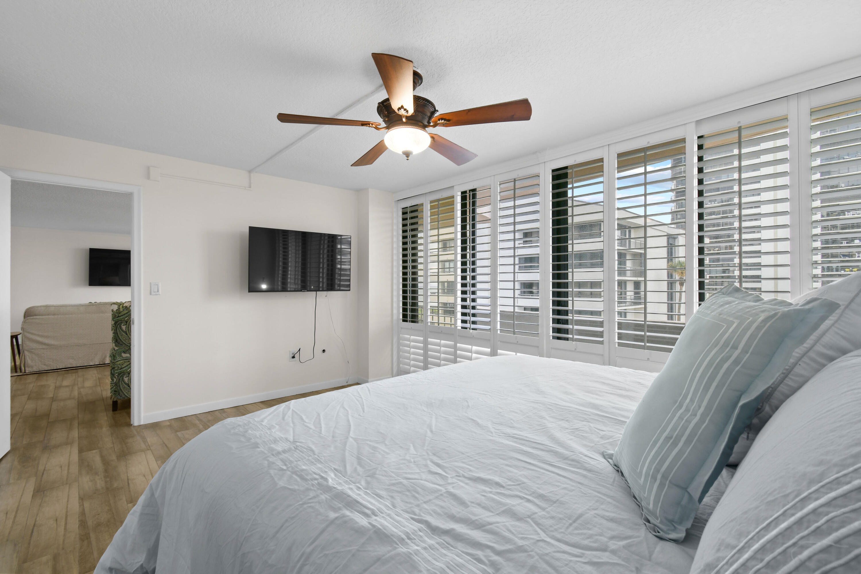 4200 North Ocean Drive, Unit 1 Riviera Beach, FL 33404 - Photo 54 of 59 a bedroom with a bed and a flat screen tv