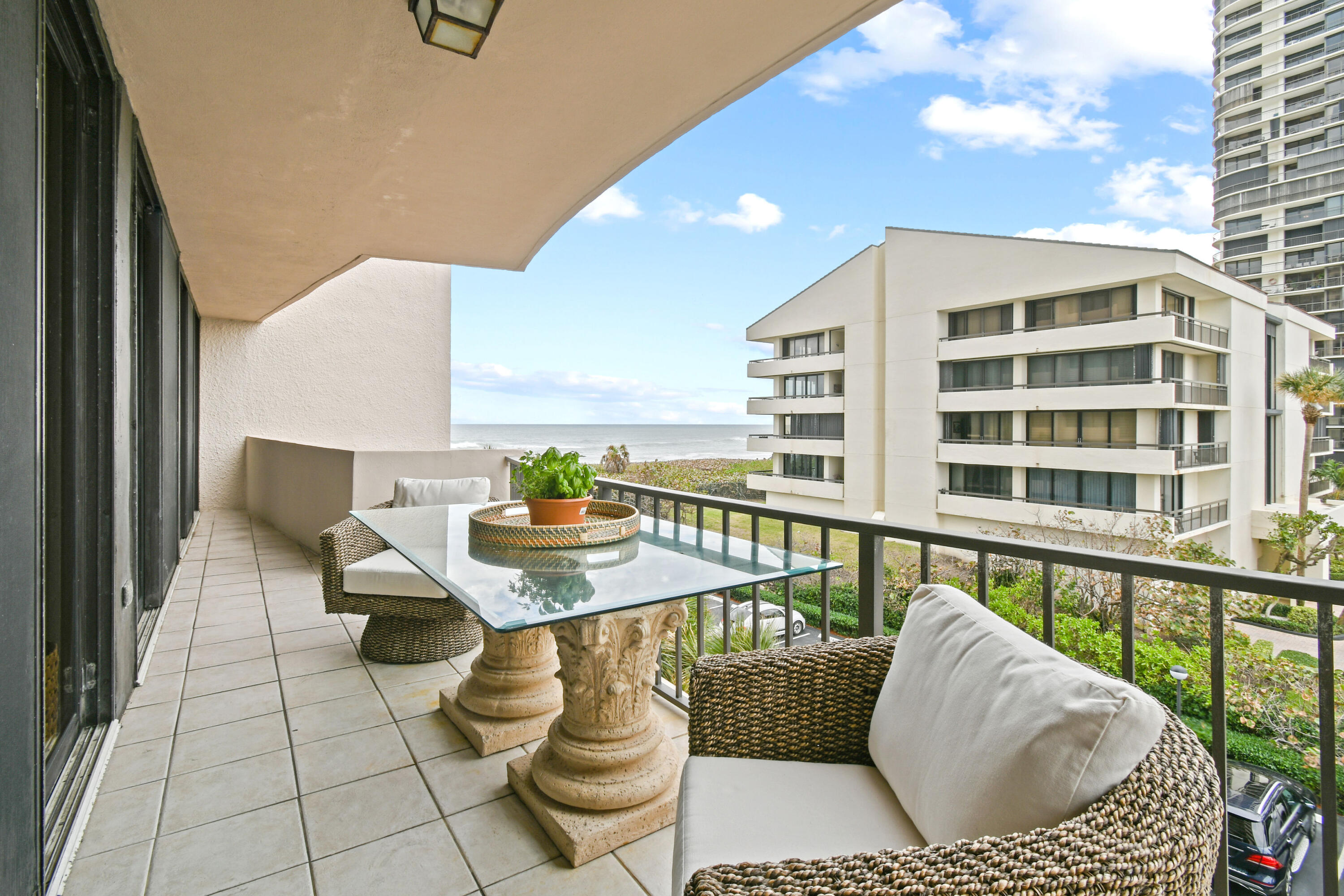 4200 North Ocean Drive, Unit 1 Riviera Beach, FL 33404 - Photo 56 of 59 a balcony with furniture and a potted plant