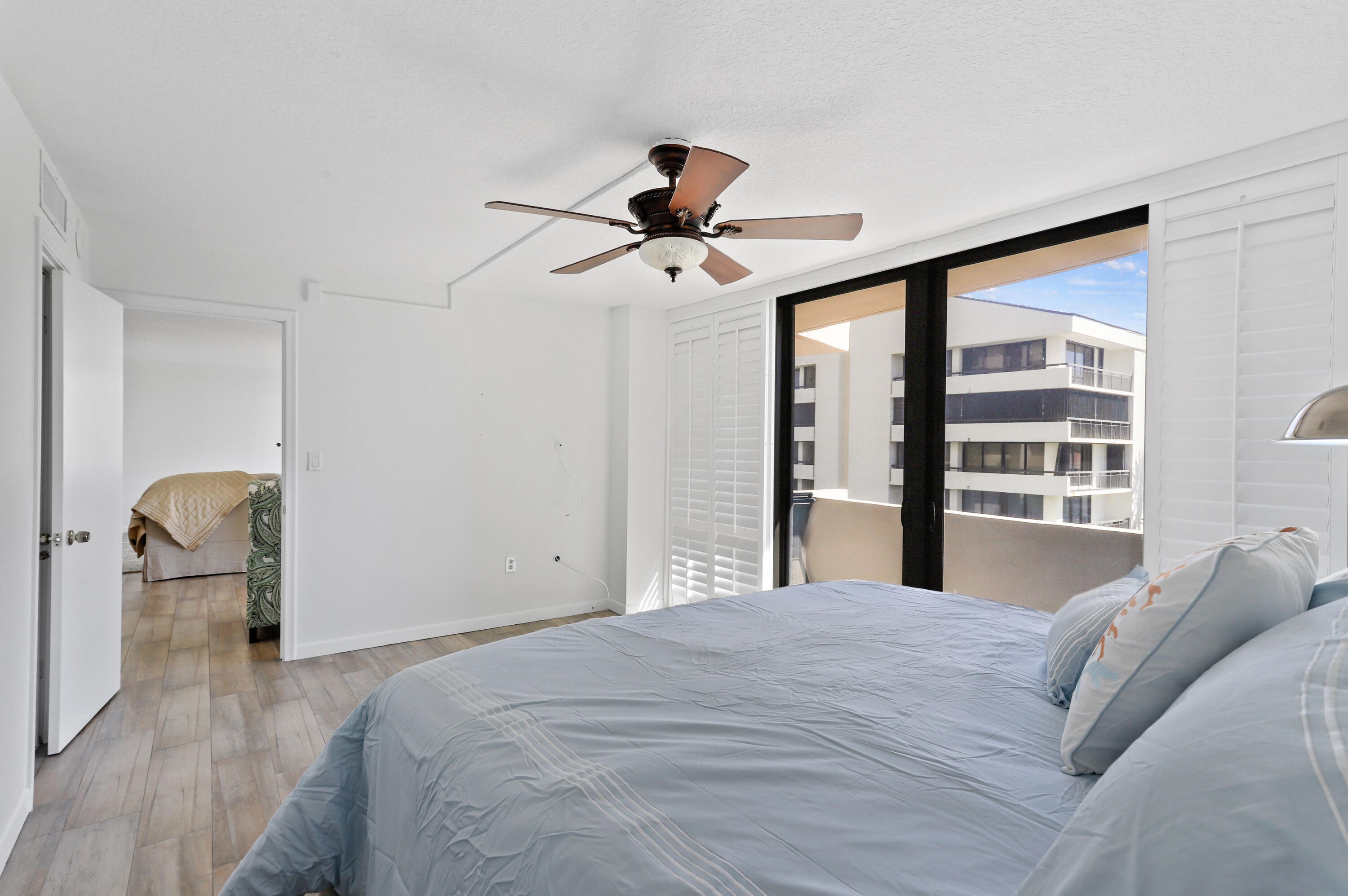 4200 North Ocean Drive, Unit 1 Riviera Beach, FL 33404 - Photo 9 of 59 a bedroom with a bed and a window