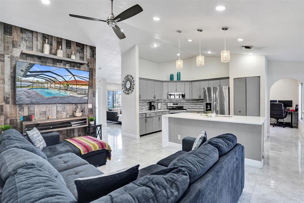 7909 Northwest 19th Street Margate, FL 33063 - Photo 13 of 33 a living room with furniture and kitchen view