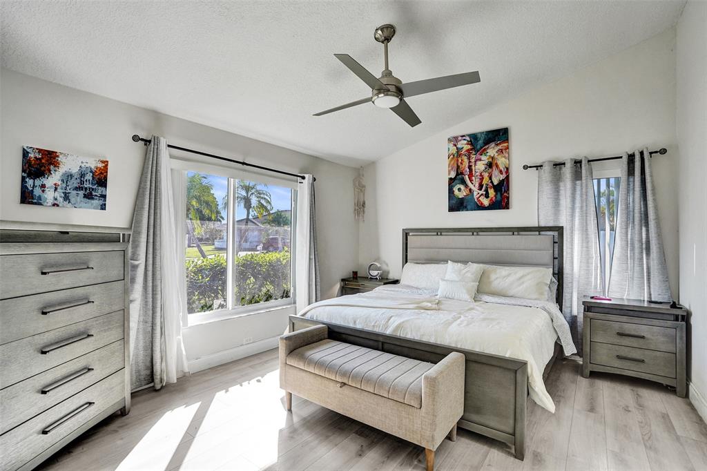 7909 Northwest 19th Street Margate, FL 33063 - Photo 15 of 33 a bedroom with a bed and a window