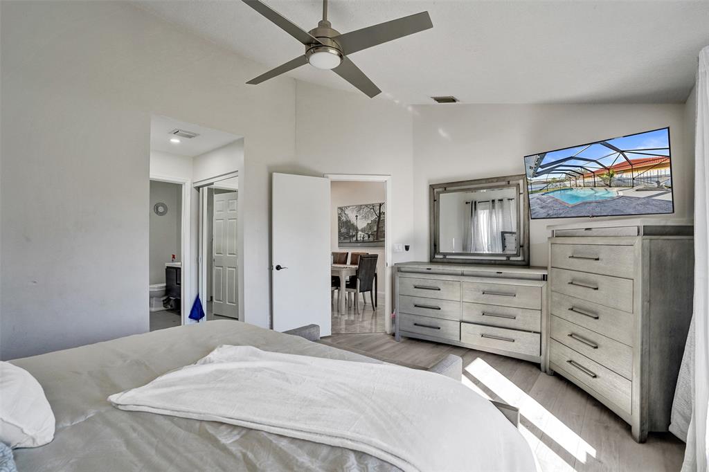 7909 Northwest 19th Street Margate, FL 33063 - Photo 16 of 33 a bedroom with a bed and a dresser