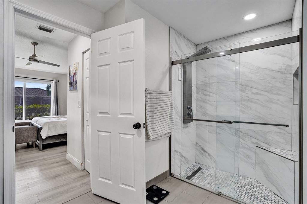 7909 Northwest 19th Street Margate, FL 33063 - Photo 18 of 33 a view of a bathroom with a tub and shower