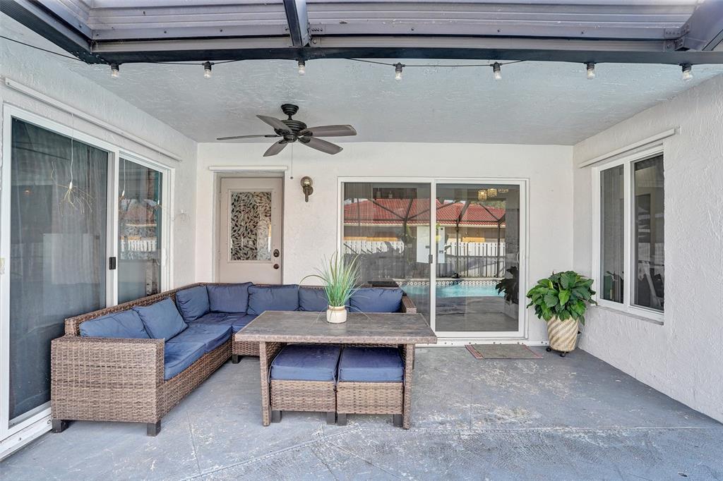 7909 Northwest 19th Street Margate, FL 33063 - Photo 29 of 33 a living room with furniture and a potted plant