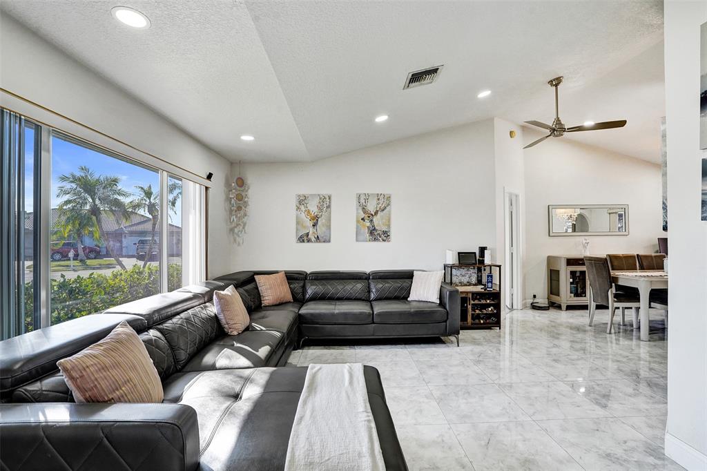 7909 Northwest 19th Street Margate, FL 33063 - Photo 4 of 33 a living room with furniture and a large window
