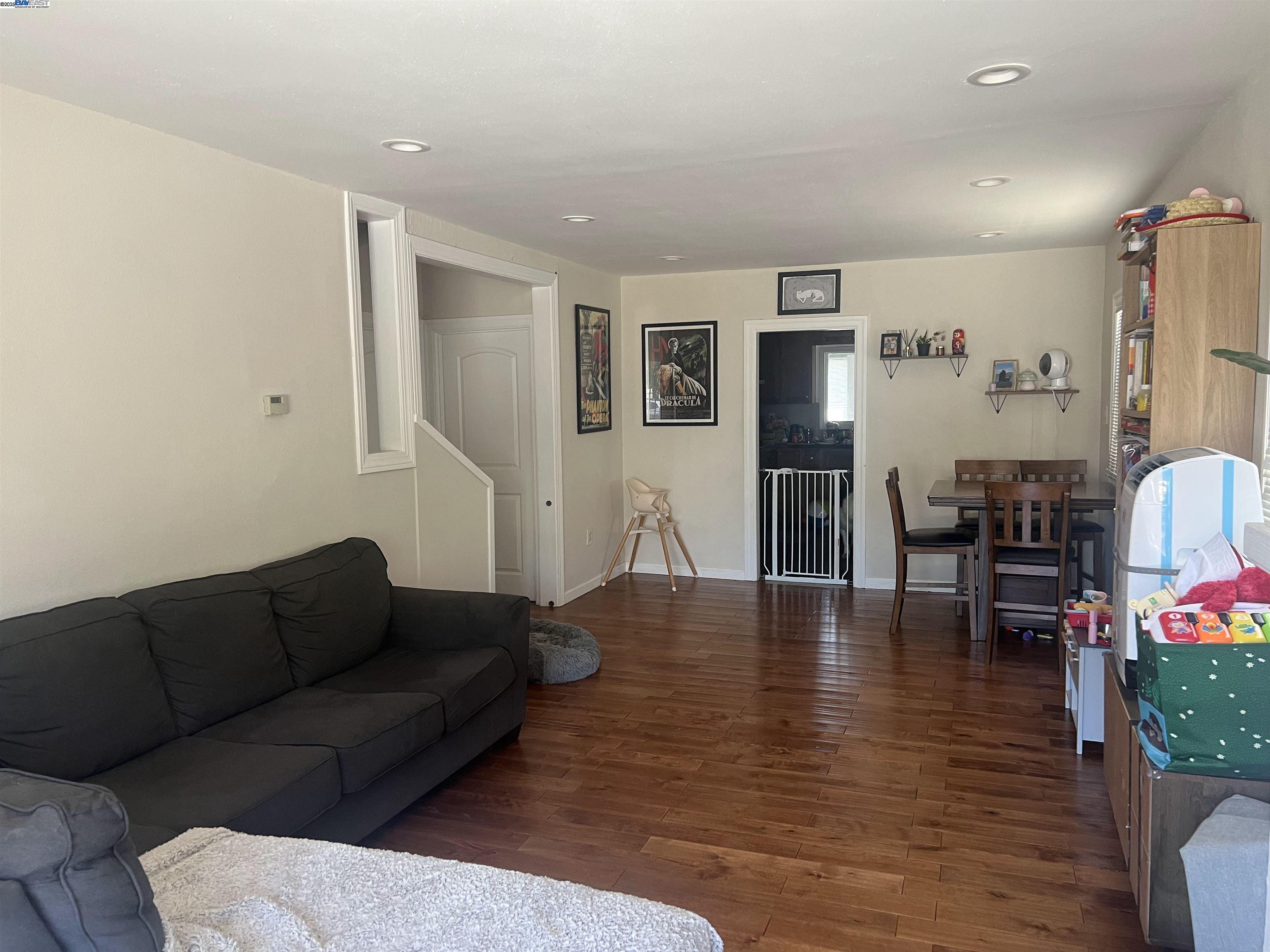 3229 MacArthur Boulevard Oakland, CA 94602 - Photo 8 of 9 a living room with furniture and wooden floor