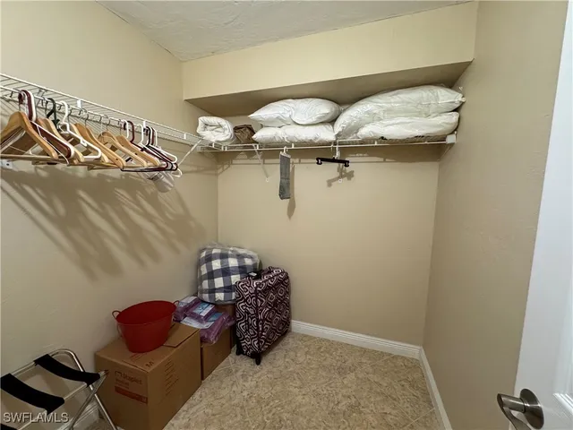 a bed room with a bed and gym equipment
