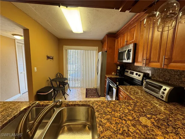 a view of a livingroom with furniture and windows