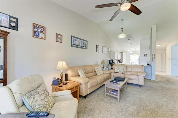 a view of a dining room with furniture and a window