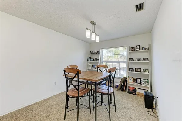 a kitchen with stainless steel appliances a refrigerator sink and cabinets