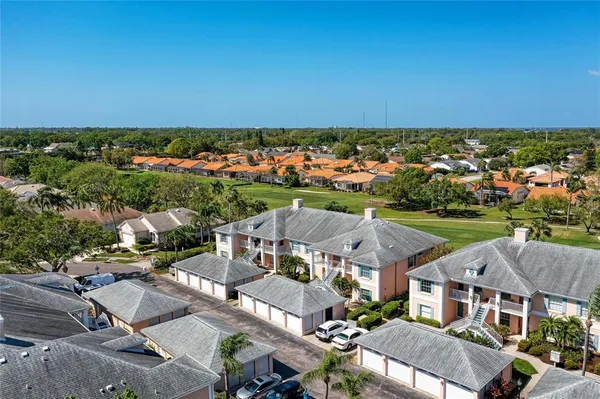 an aerial view of a residential houses with outdoor space